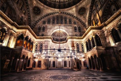 inside a dim lit mosque in Istanbul